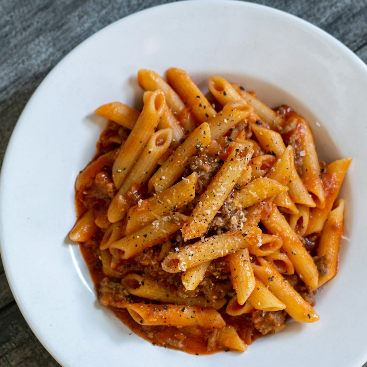 Pasta with eggplant, lentils, tomato sauce, and herbs