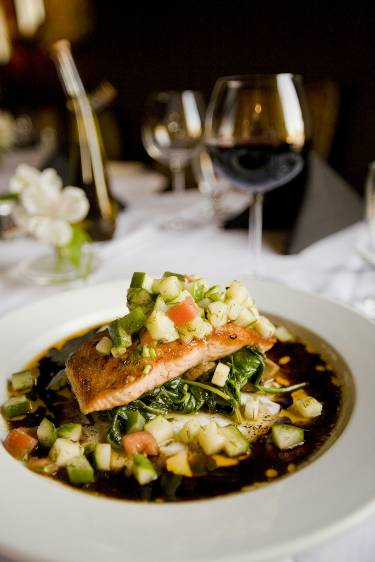 Roasted salmon over couscous with herbs and capers